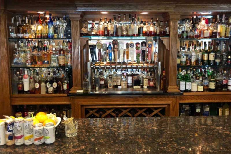 Bar counter with view of liquor bottles