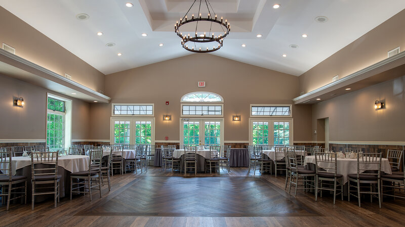 Ballroom with view of many round tables and dance floor